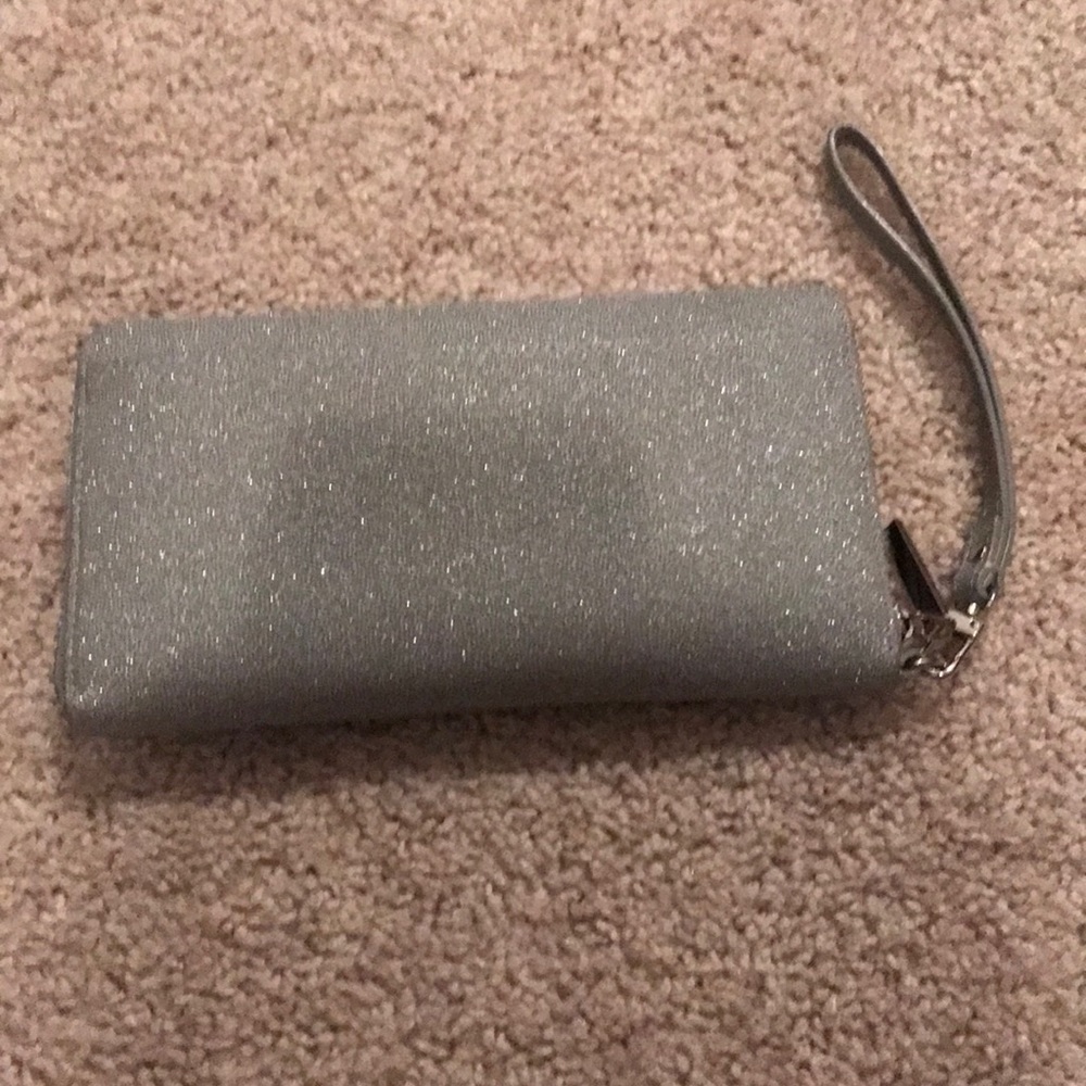 Gently used clutch/wallet in sparkly silver
